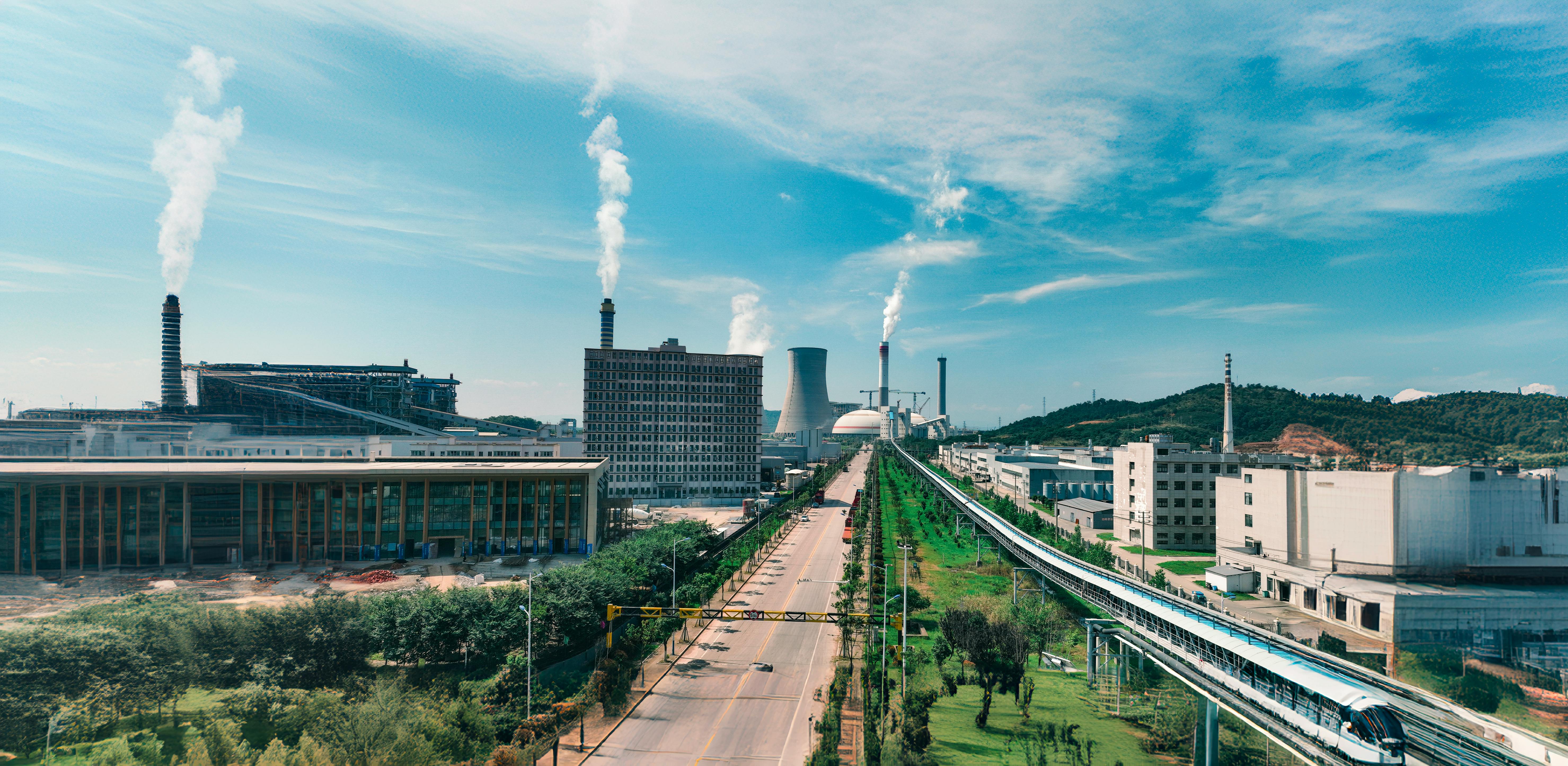 Aerial view of Jiujiang industrial area with factories and smoke stacks.