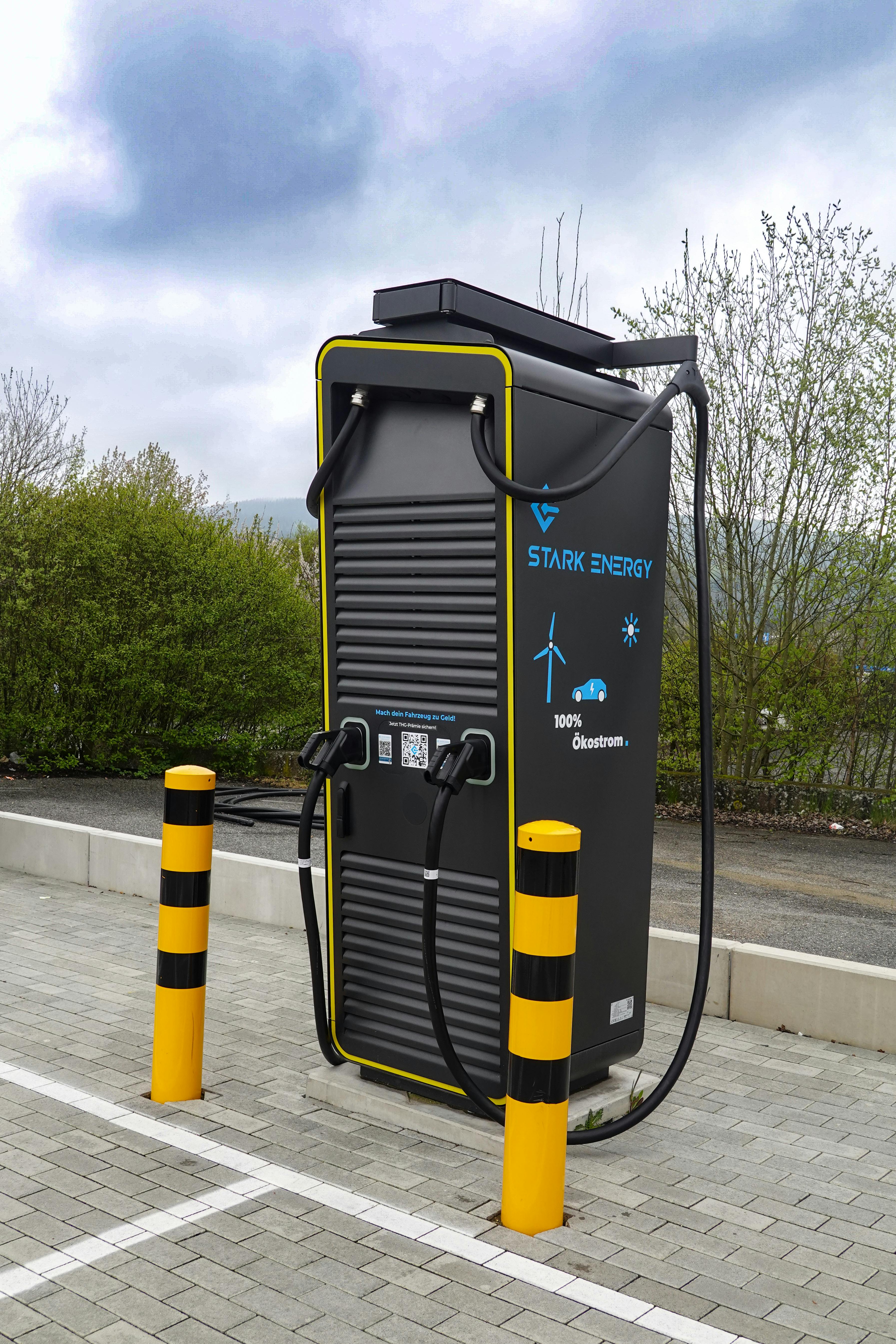 A state-of-the-art electric vehicle charging station situated outdoors in a public area.