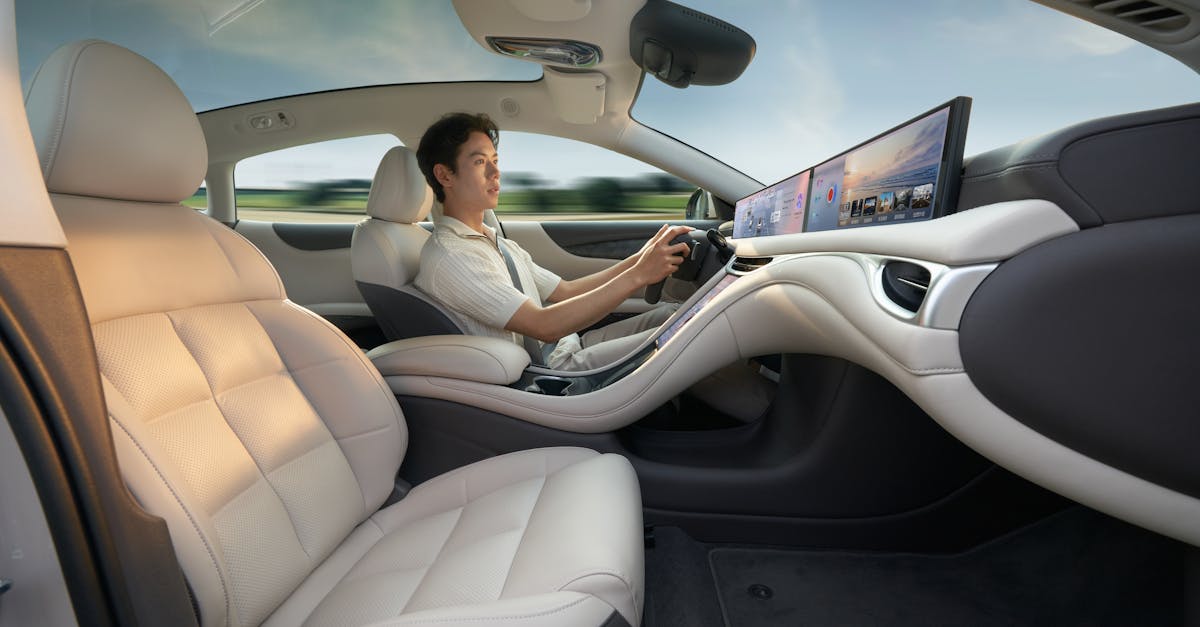 A modern electric car interior showcasing advanced technology with a driver enjoying a smooth ride.