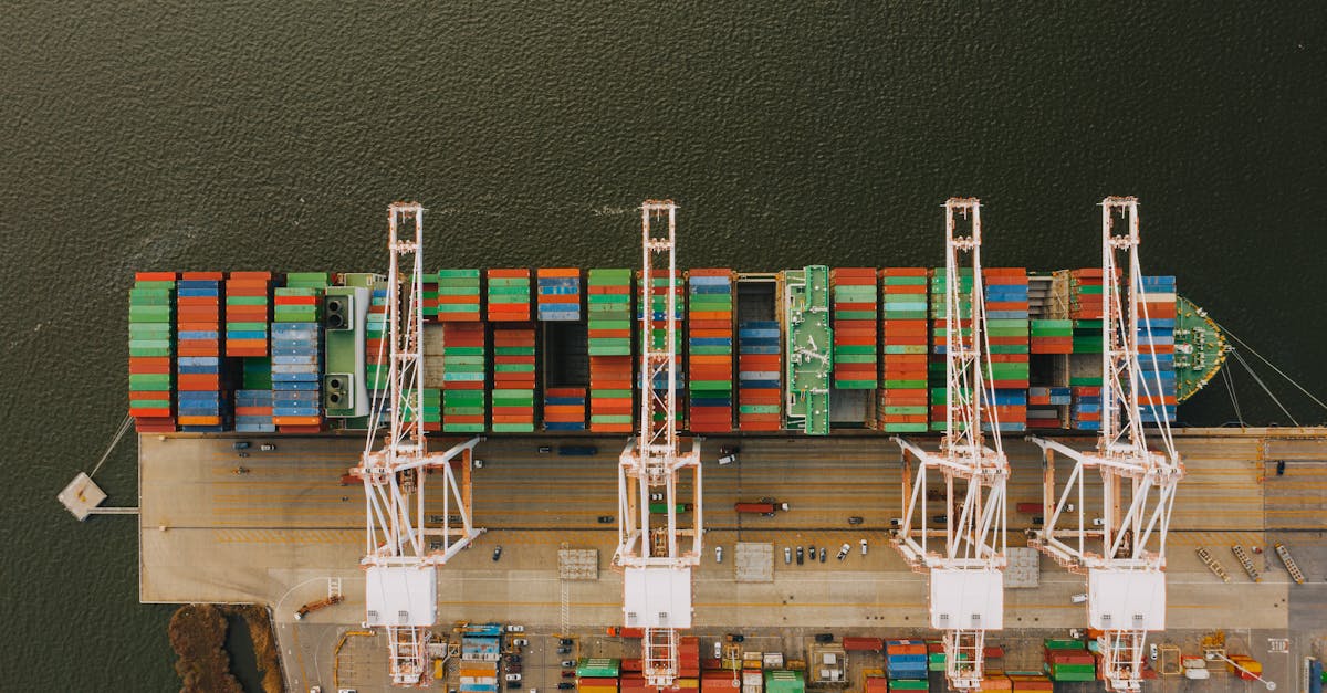 Overhead shot of colorful cargo containers and cranes at Baltimore's bustling port.
