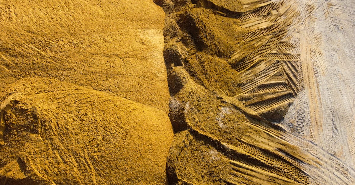 Top view of sand mounds with tire tracks in Ashdod, Israel.