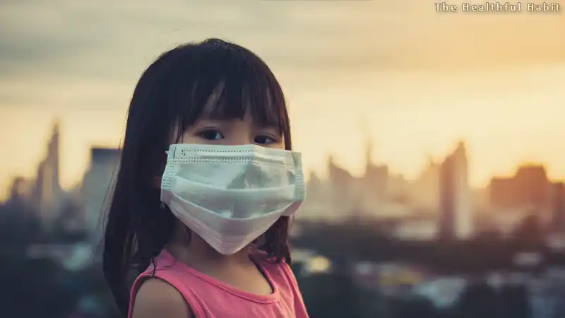 a dramatic scene of a city pollution with a little girl wearing mask