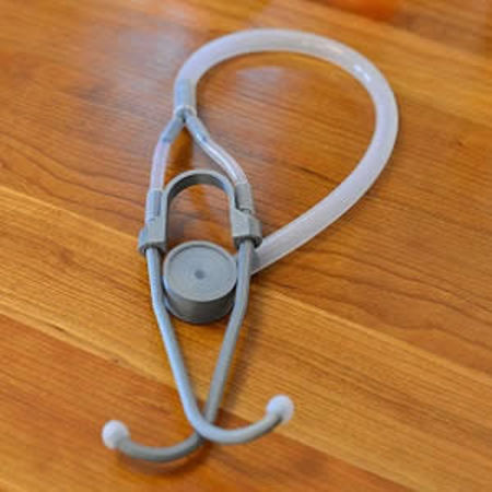 The stethoscope is built using 3-D printed parts, and recycled plastic tubing.