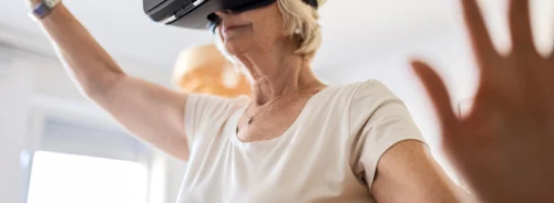 Older adult using a virtual reality headset, representing immersive technology applications in healthcare, rehabilitation, and cognitive training.&nbsp;