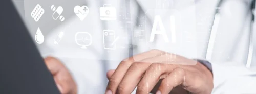 Clinician uses AI tools on a laptop to support care and documentation.&nbsp;