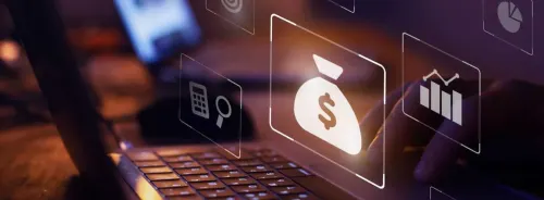 Close-up of a person working on a laptop with digital finance and analytics icons symbolizing financial planning, investment&nbsp;analysis&nbsp;and business growth.&nbsp;