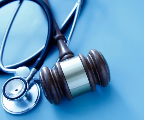 Gavel with stethoscope symbolising healthcare law and regulation.&nbsp;
