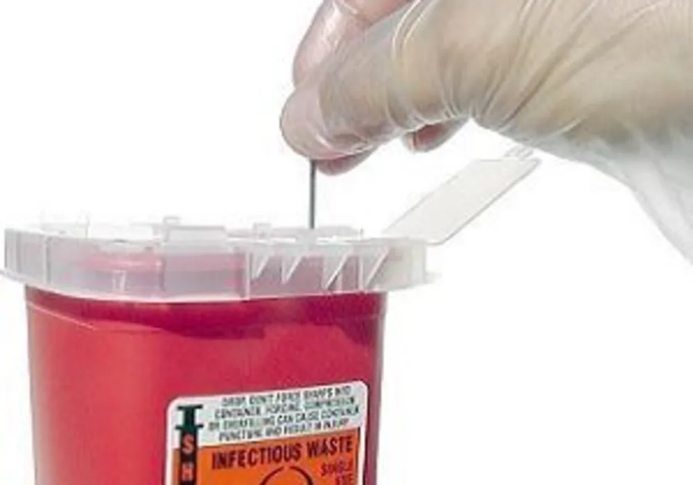 used needles are placed into a sharps container 