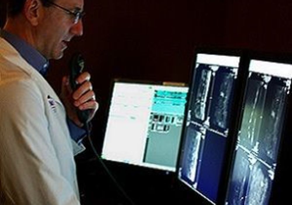 radiologist reviews imaging findings