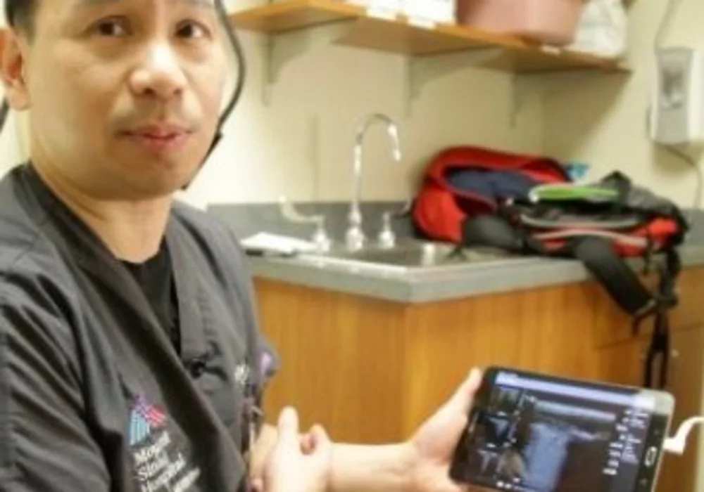 Dr. James Tsung, MD, showcases a lung ultrasound display on a tablet. Credit: Image courtesy of Mount Sinai Health System