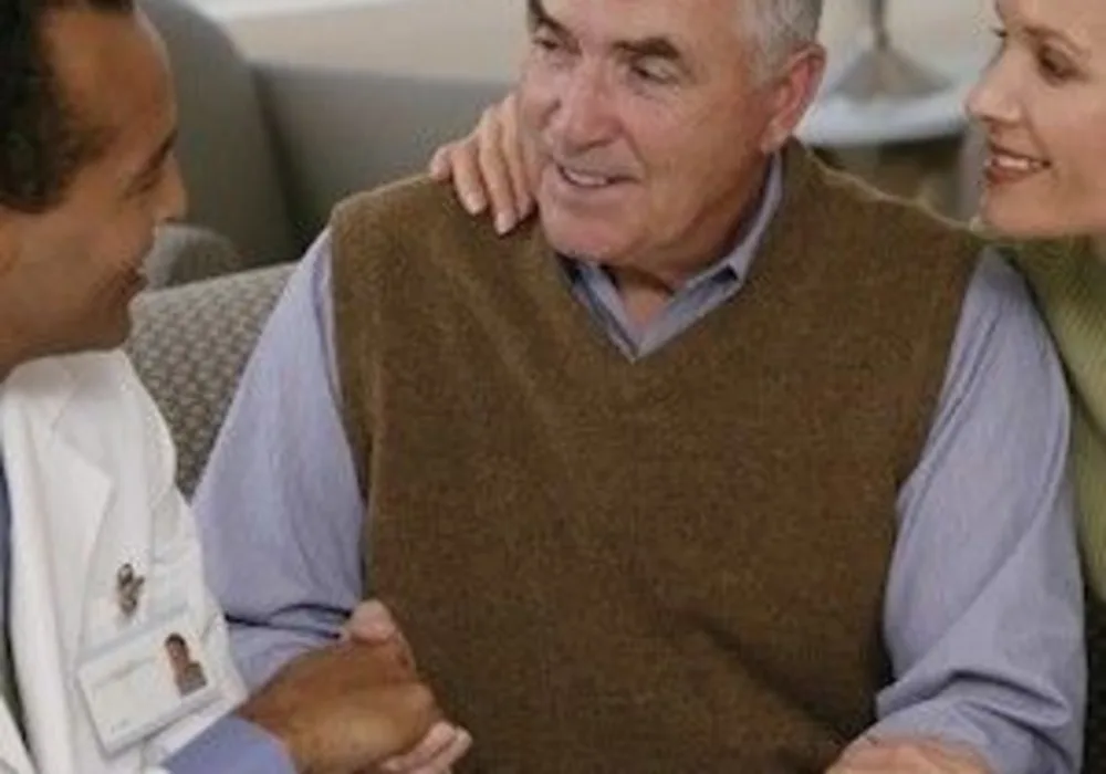 Stock photo, doctor talking to a man and woman, credit American Thoracic Society