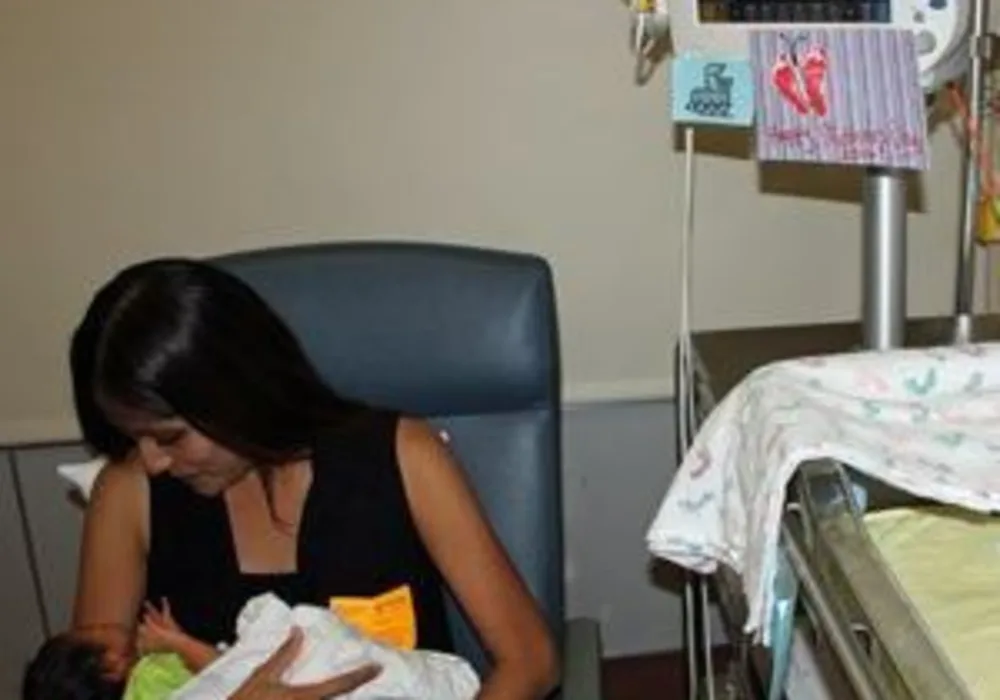 Melissa Renteria holds her newborn baby, Arthur, while he&#039;s monitored by the HeRO technology (credit: University of San Diego Health)