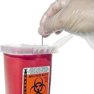 used needles are placed into a sharps container 