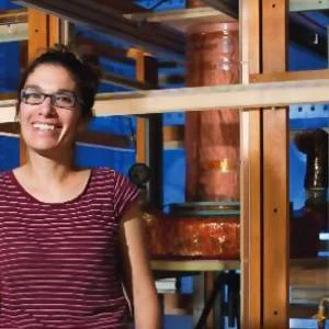 Michelle Espy, project leader at Los Alamos National Laboratory, in front of the battlefield MRI, which uses ultra-low-field magnetic resonance imaging to create images of injured soft tissues, such as the brain.