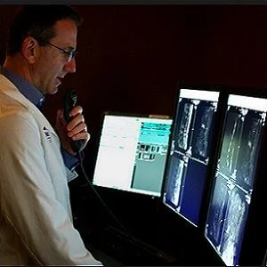 radiologist reviews imaging findings