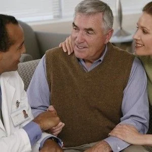 Stock photo, doctor talking to a man and woman, credit American Thoracic Society