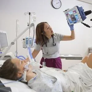 Dr. Michelle Kho&#039;s research uses the RT-300 supine bicycle -- which allows patients to work on strengthening their legs while they are confined to their hospital bed. Image credit: Marta Hewson/Photography