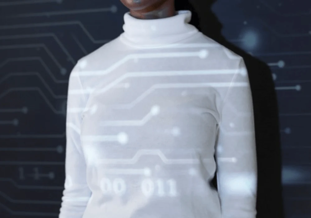 Woman standing with digital circuit projection symbolising technology and innovation&nbsp;