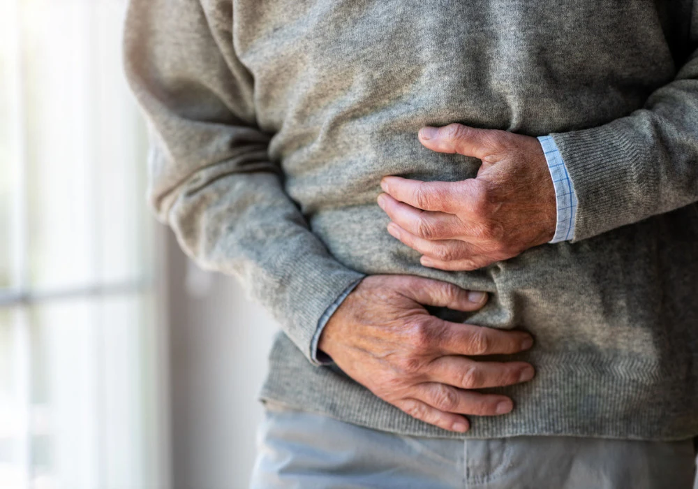 Senior man with stomach pain &ndash; symptoms of liver disease, indigestion, or abdominal discomfort&nbsp;