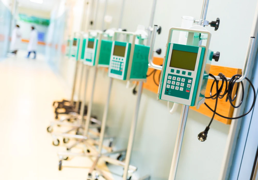 Row of infusion pumps lined up in a hospital corridor, ready for intravenous therapy and patient care support.&nbsp;