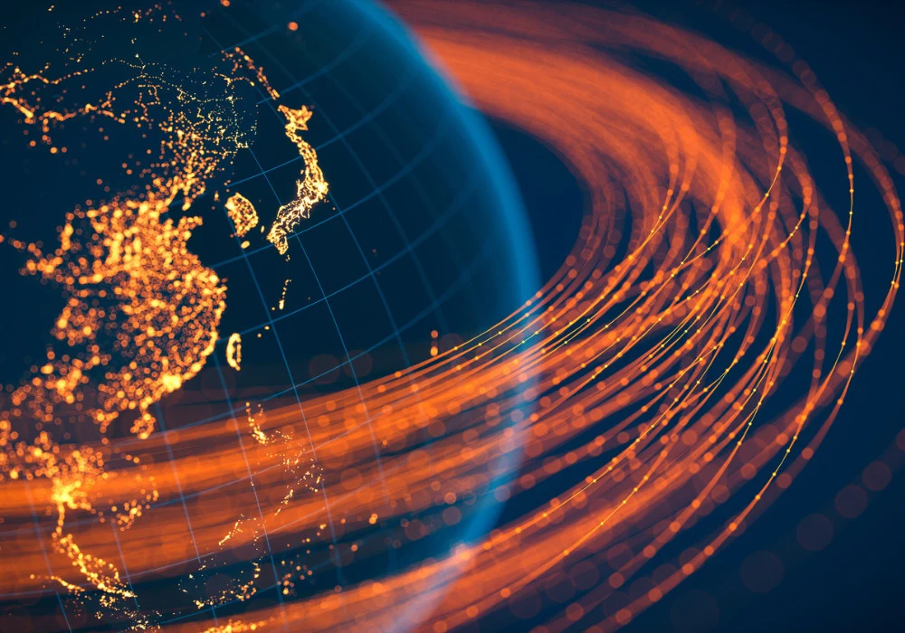 Global data connectivity and digital infrastructure across Asia-Pacific at night, with glowing networks orbiting Earth.&nbsp;