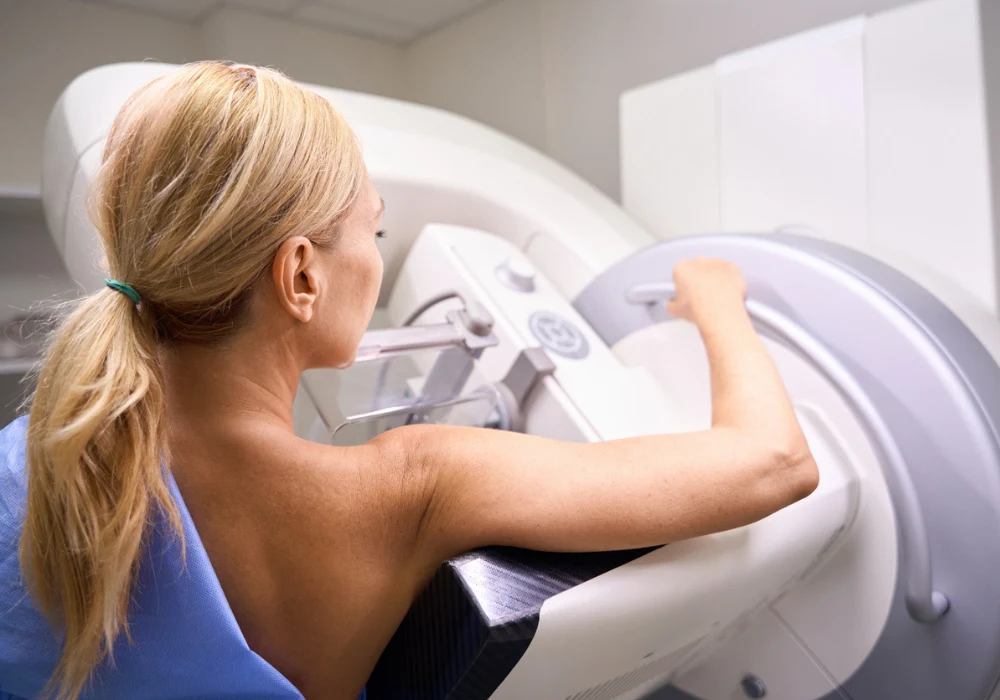 Woman undergoing mammography breast screening with diagnostic imaging equipment.&nbsp;
