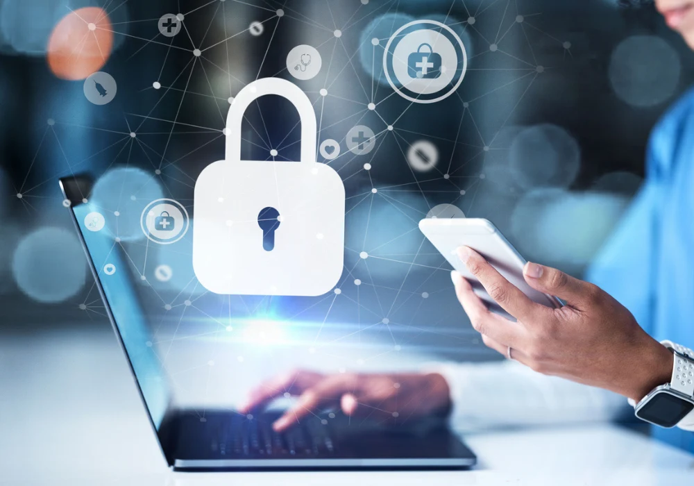 Clinician using a tablet with padlock icons, illustrating healthcare cybersecurity.&nbsp;