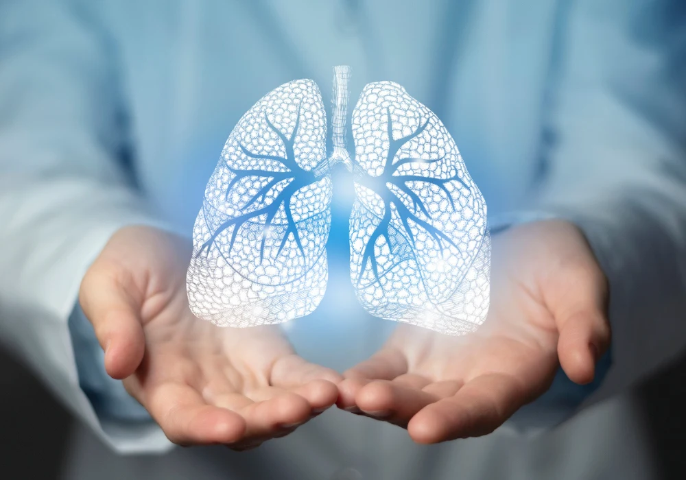 Holographic lungs in clinician&rsquo;s hands symbolising chest X-ray access for earlier lung cancer diagnosis in hospital radiology.