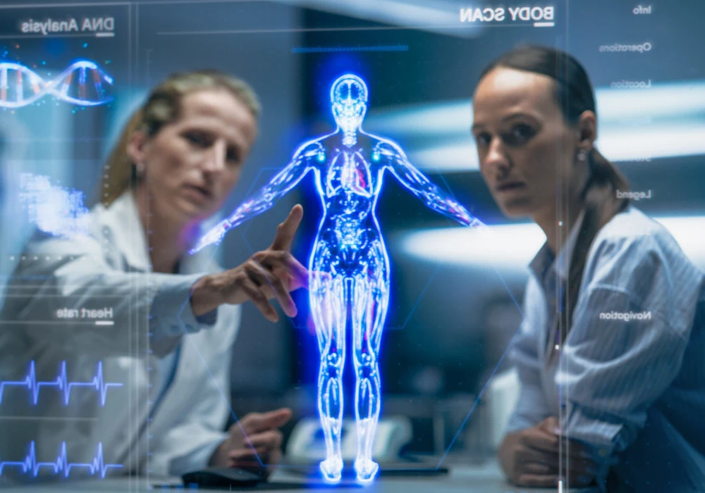 Clinicians review a holographic patient model on a digital dashboard, representing clinical AI consulting and decision support.&nbsp;