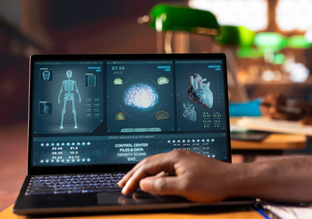 Clinician reviewing imaging AI dashboard on a laptop.&nbsp;