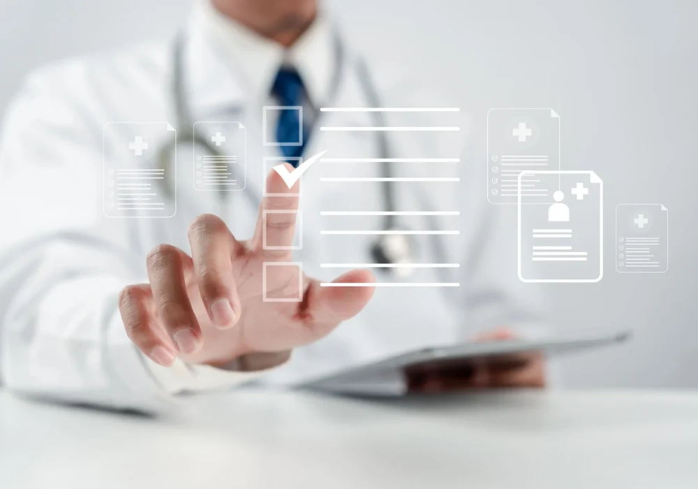 A clinician interacts with a transparent digital interface, tapping a medical document icon surrounded by healthcare symbols, representing electronic health records and digital patient data management.&nbsp;