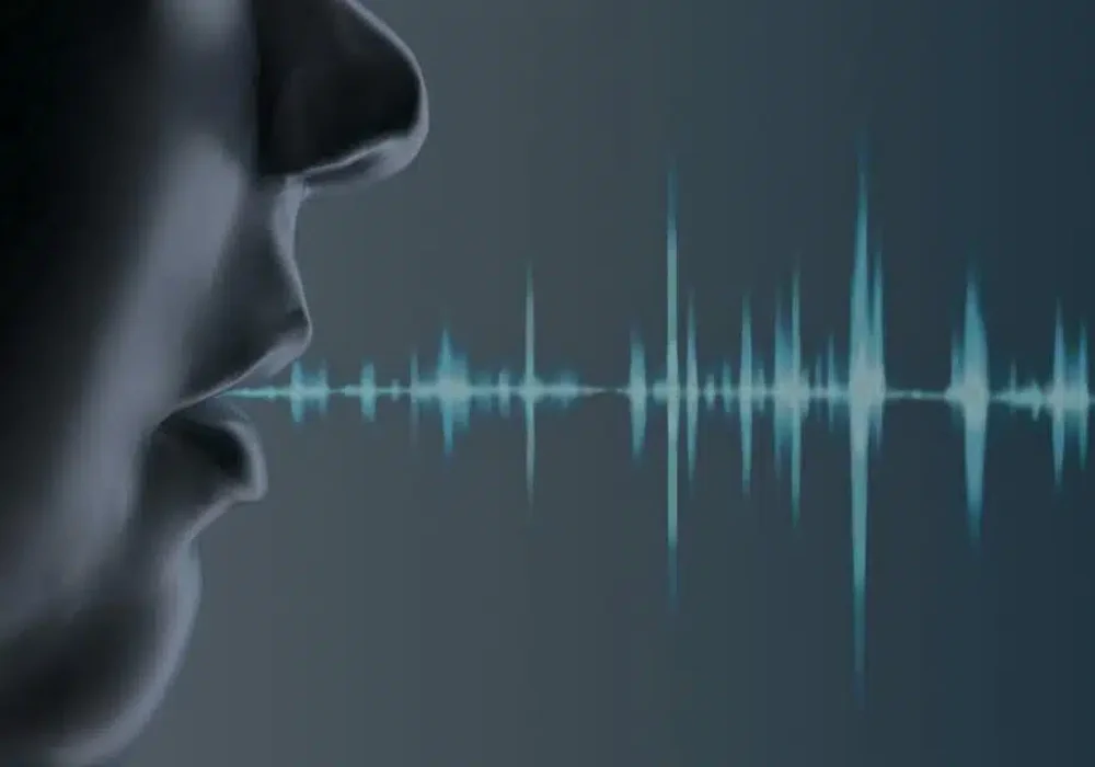 Person speaking with digital soundwave representing voice recognition, speech technology and AI-driven communication&nbsp;