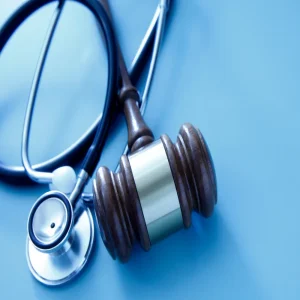 Gavel with stethoscope symbolising healthcare law and regulation.&nbsp;