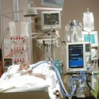 monitoring equipment surrounds a patient in the ICU