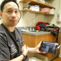 Dr. James Tsung, MD, showcases a lung ultrasound display on a tablet. Credit: Image courtesy of Mount Sinai Health System