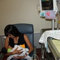 Melissa Renteria holds her newborn baby, Arthur, while he&#039;s monitored by the HeRO technology (credit: University of San Diego Health)