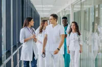 Group of Young Doctors Walking in Hospital Corridor &ndash; Confident Medical Team in Motion