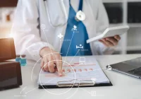 Doctor analysing digital health data and medical metrics using tablet and virtual interface.&nbsp;