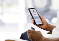 Patient using telehealth app on smartphone to consult with doctor and manage healthcare online&nbsp;