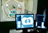 Neurologist analysing brain scans and neural data on high-resolution monitors in advanced lab