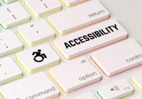 Keyboard with accessibility key and wheelchair icon promoting digital inclusion.
