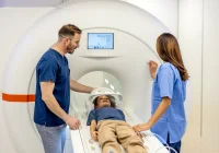 Paediatric MRI scan preparation with medical staff assisting a child in a modern imaging centre.&nbsp;