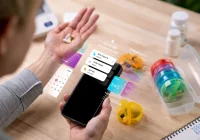 Medication reminder app on smartphone with a pill organiser and adherence tracking.&nbsp;