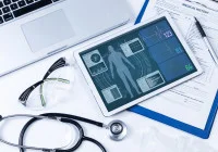 Electronic health record dashboard with patient vitals on a tablet.&nbsp;