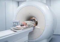 Older adult entering a hospital imaging scanner, illustrating CT colonography for colorectal cancer screening.&nbsp;