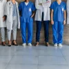Multidisciplinary healthcare team standing together, supporting hospital workforce planning, clinical collaboration and coordinated patient care.