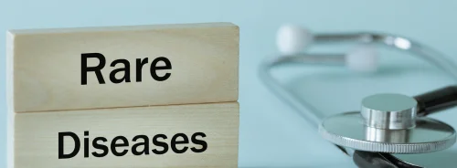 Rare diseases written on wooden blocks together with medical stethoscope.