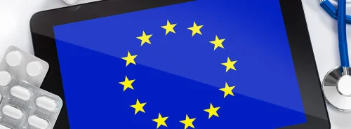 EU flag on a medical tablet with stethoscope and medicines. 