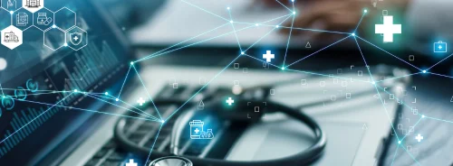 Doctor analyzing medical of business report and medical examination with network connection on laptop screen