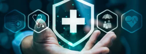 Healthcare protection shield with medical icons, representing patient safety, risk management and health insurance coverage.